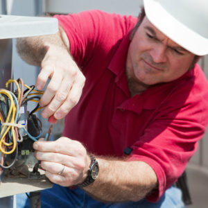 technician performing AC tune up